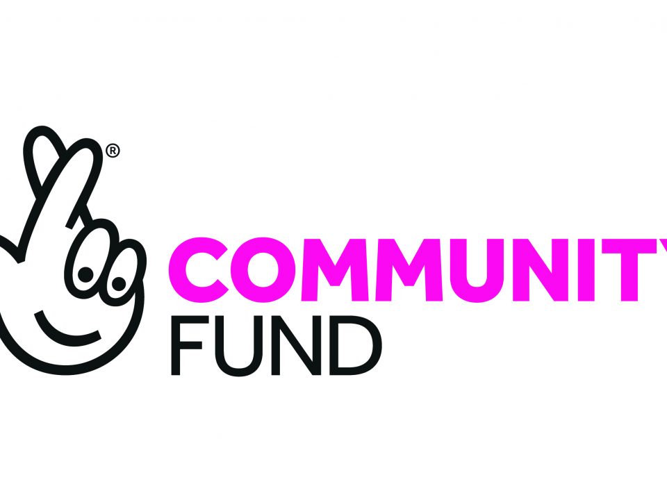 A drawing of a hand with crossed fingers beside the words Community Fund