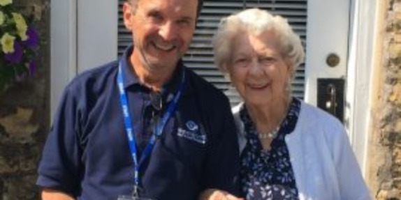 A smiling man and lady