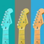 A row of multi coloured guitars in a row.