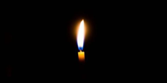 A candle flame in the dark